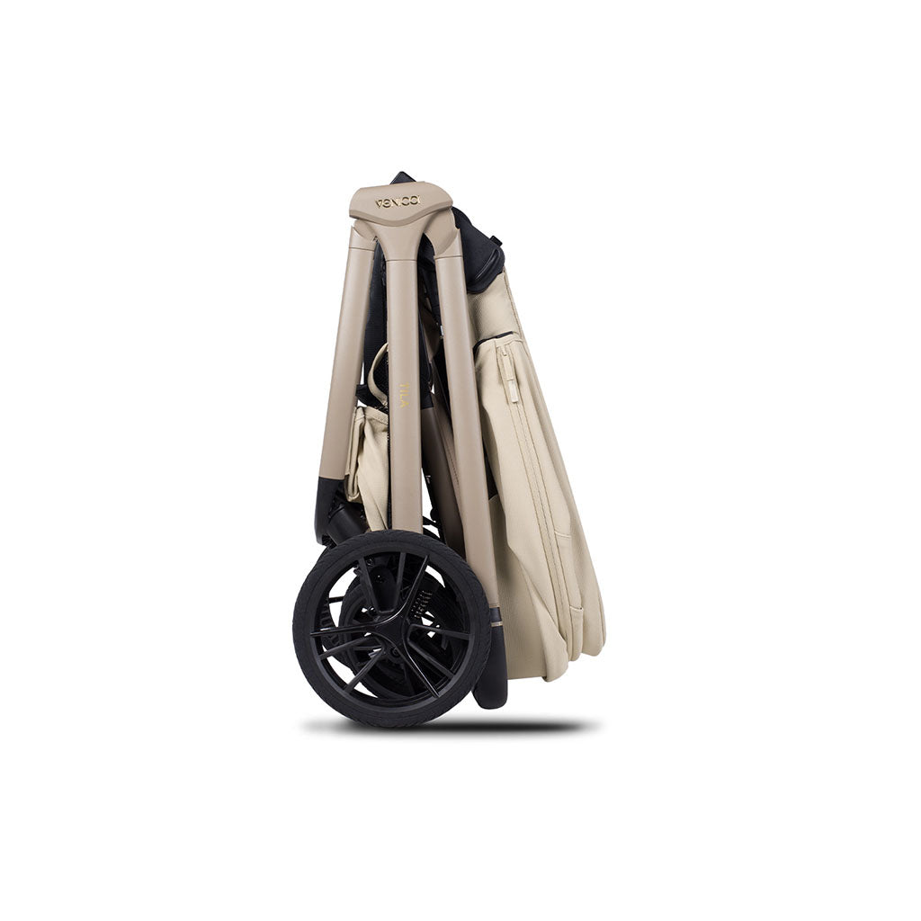 Beige baby stroller folded and ready for travel on a white background